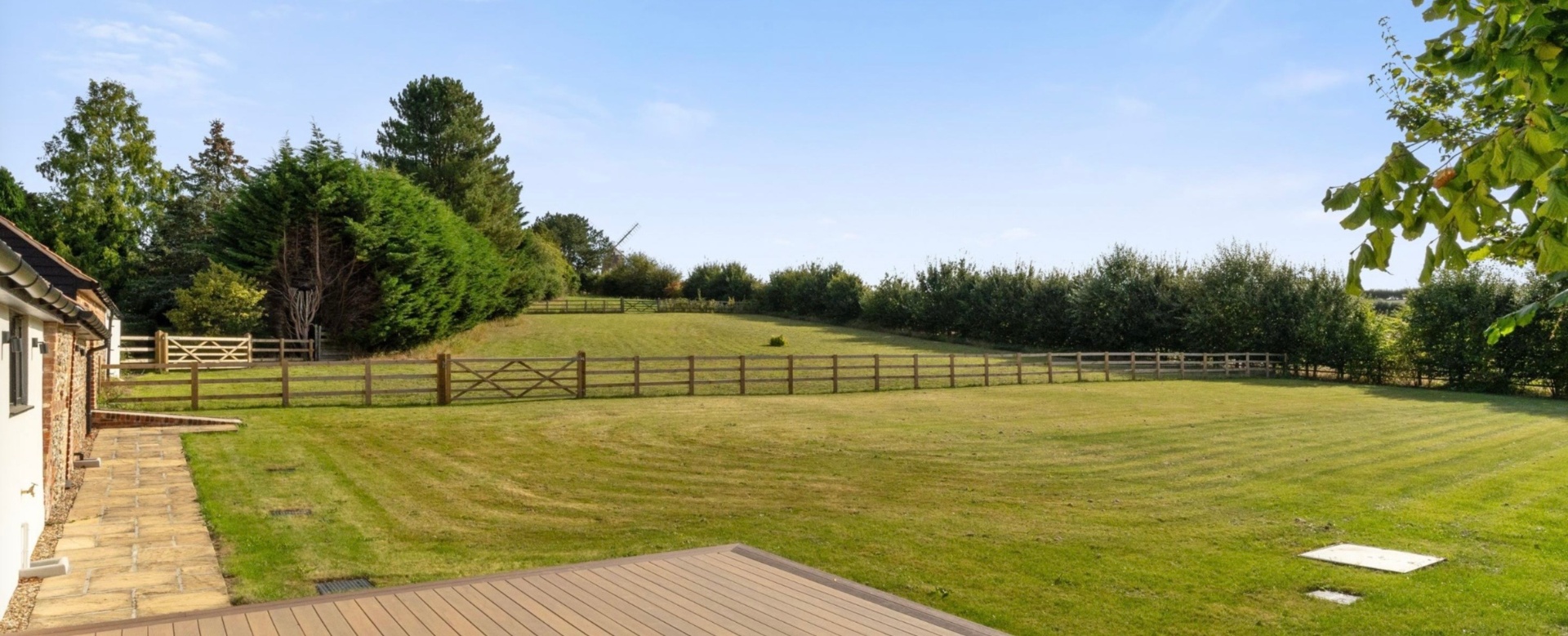 Landscaped garden with paddock views