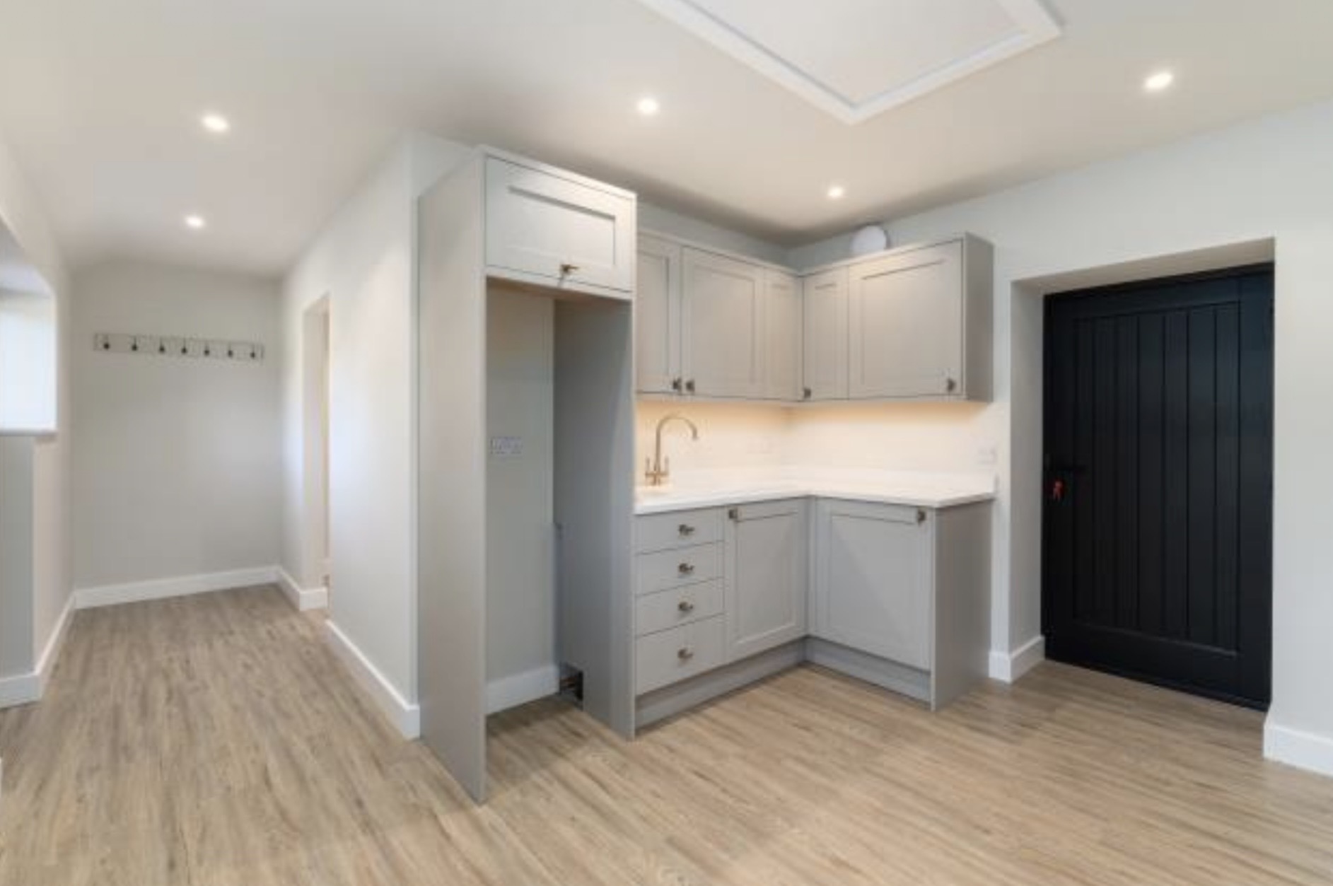 Utility room with shaker cabinets
